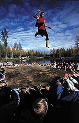 A child enjoys the blanket toss